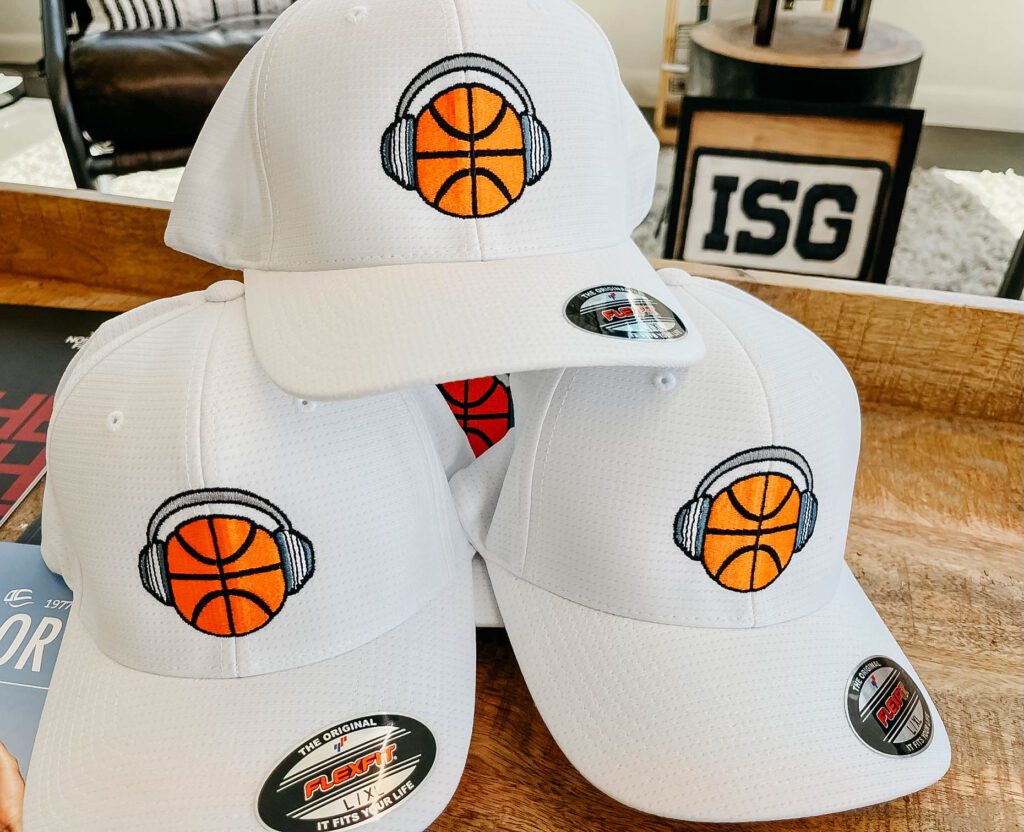 White baseball caps with basketball logo emroidered